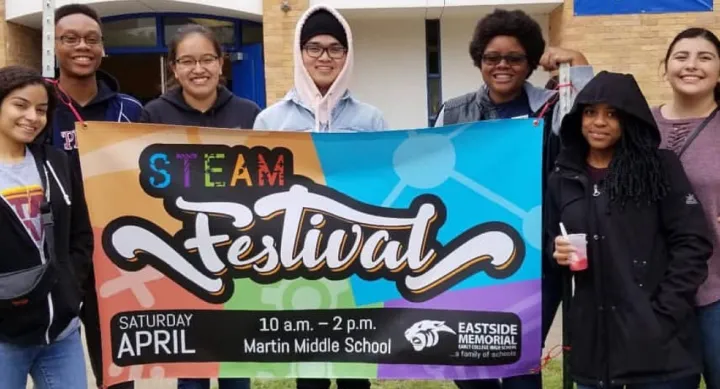 TIPCO - Group Photo holding a STEAM Festival Banner